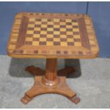 A marquetry chess table, 45cm tall.