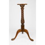 A Victorian mahogany jardinere stand, with carved baluster column and tripod base, 100cm high.