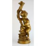 A large table lamp, in the form of a cherub, 76m high.