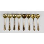 A set of eight German silver gilt salt spoons, marked 800 grade, 1.42toz.