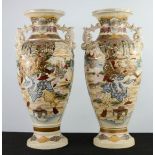 A pair of Chinese vases, enamelled with figural scenes to the bodies, and shaped twin handles,