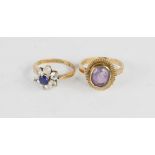 Two 9ct gold rings, one set with an oval amethyst, the other in paste flowerhead form, 5.9g.