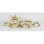 A part tea service, 19th century, hand painted floral and gilt decoration.