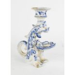 A Delft blue and white candlestick in the form of a dragon, 18cm high.