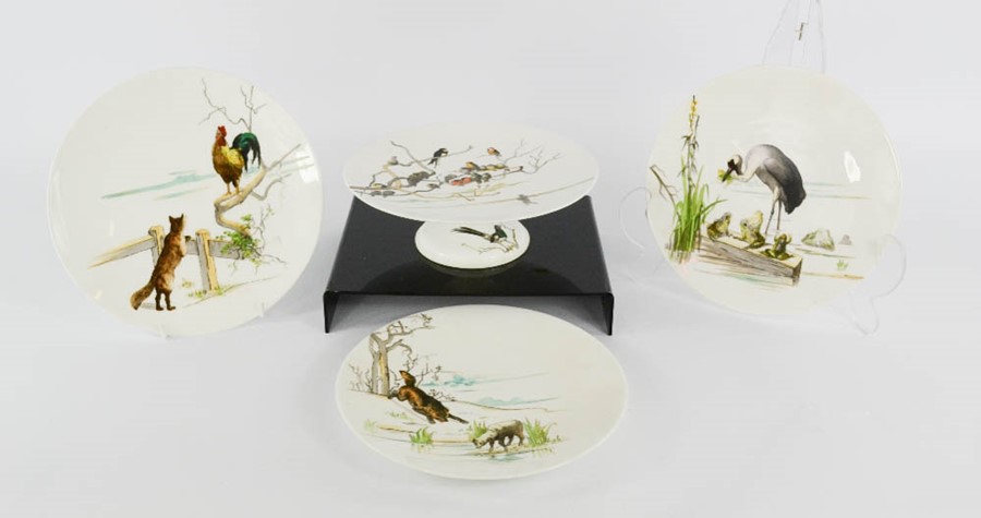 A group of three hand painted plates and a comport, handwritten verso in puce: Wolf & Lamb, and