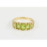 A 9ct gold and peridot ring, 3.1g.