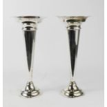 A pair of silver plated rose vases.