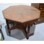 An octagonal top occasional table, raised on turned legs.