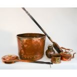 A large copper log bucket, two warming pans, a copper kettle and other copper items.