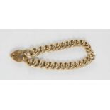 A 9ct gold chain link bracelet with heart form lock and safety chain, 12.3g.