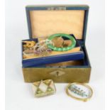 A leather jewellery box containing various jewellery and a small mother of pearl coin purse.