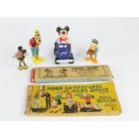 A group of Disney figures including Mickey Mouse, Donald Duck, Goofy, together with lantern slides