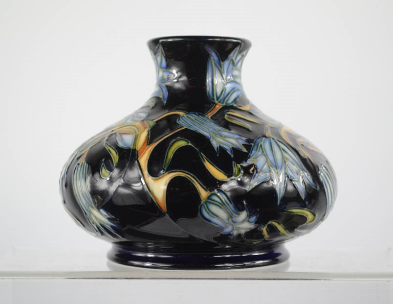 A Moorcroft vase of squat form decorated in the Carillon pattern, designed by Sian Leeper, 3/250,