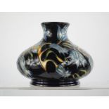A Moorcroft vase of squat form decorated in the Carillon pattern, designed by Sian Leeper, 3/250,