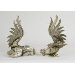 A pair of silver plated fighting cockerels, 18cm high.