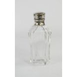 A French glass perfume bottle with white metal lid.