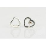 A pair of 9ct white gold heart form earrings, set with small diamonds, 2.1g.