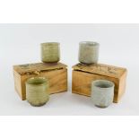 Two pairs of Chinese studio pottery cups, bearing seal marks to the bases, in wooden boxes bearing