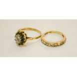 A 9ct gold oval and starburst diamond and emerald ring, size N, and a 9ct gold and paste band size