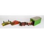 A Hornby clockwork LMS Locomotive, together with a Hornby wagon, a tin plate crossing and bridge,