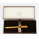 A Dunhill ball point pen, together with guarantee and original box, together with a Dunhill ledger.