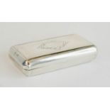 A white metal 19th century snuff box, with engraved decoration.