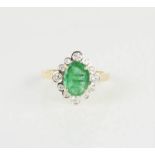A yellow metal, diamond and emerald flower head ring, 3.9g.