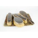 A silver and tortoise shell dressing table brush set, together with faux tortoise shell tray.