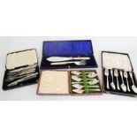 A group of boxed flatware to include two sets of grapefruit spoons, and a pair of fish servers. (4)