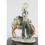 Lladro pot seller with donkey.