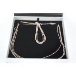 A silver necklace and bracelet set, boxed.