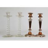 A pair of pressed glass candlesticks 24cm high, together with a pair of Old Sheffield plate