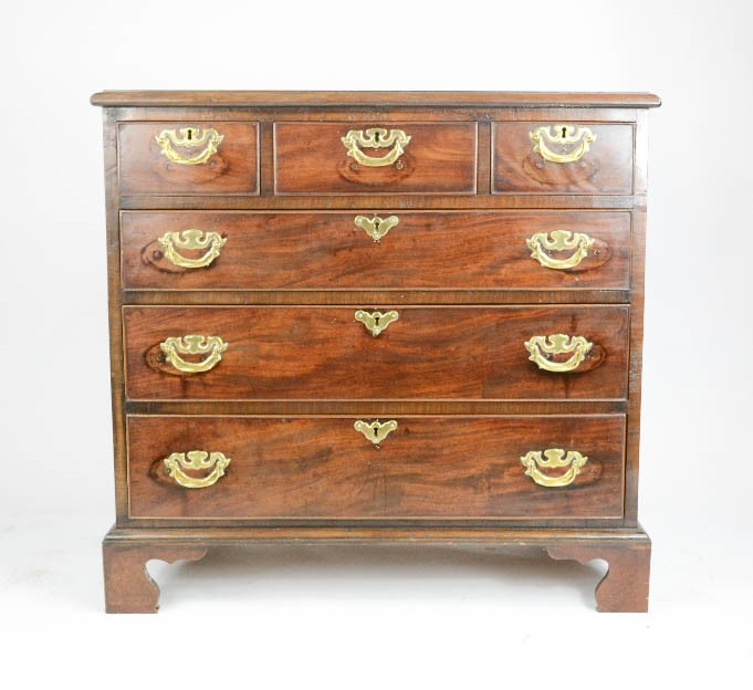 A Georgian chest of drawers, with three small above three long graduated drawers with cockbeaded