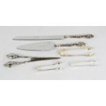 Three pairs of silver sugar tongs, 1.78toz, together with a fish slice and fork, and a pair of