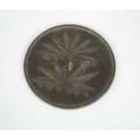 An Eastern Han Dynasty Chinese bronze mirror, 1-2nd century AD, depicting lotus leaves.