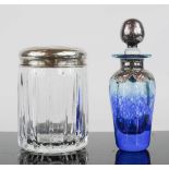 A silver topped cut glass dressing table jar, machine engraved and marked 925, together with a glass