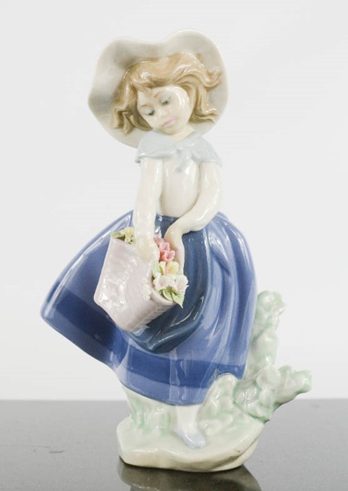 Lladro young girl with flowers