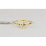 An 18ct gold and diamond solitaire ring, the brilliant cut 1ct yellow diamond in a four claw