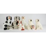 Ten Staffordshire dogs, dating from 19th century and later, of various style and size, 17cm high.
