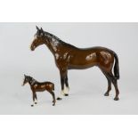 A Beswick horse 20cm high, and a Beswick foal, 8cm high.
