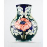 A Moorcroft pottery baluster vase decorated in the Poppy pattern, circa 1996, painted and