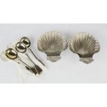 A pair of scallop shell form dishes, together with six nickel spoons.