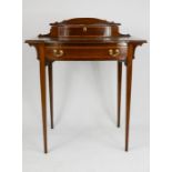 An Edwardian mahogany ladies writing desk, the raised top housing a single drawer, the leather top