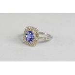 A 9ct white gold, diamond and tanzanite ring, brilliant cut, 0.33ct, colour D, clarity SI1, together