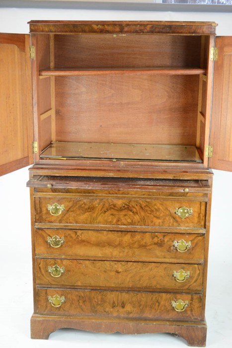 A walnut veneered gentleman's cabinet on chest, the two panelled doors above a brush slide, four - Image 2 of 2