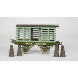 A Hornby tin LNER Milk Traffic freight carriage.