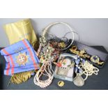 A group of costume jewellery including pearl necklaces, beaded necklaces and a British Rail shawl.