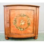 A 19th century Satinwood commode, with a painted musical group to the centre of the bowed door, 93