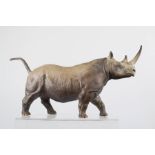 A Coalport model of a Rhinoceros, 13cm high.