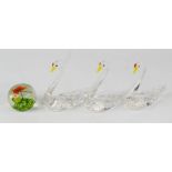 Three Murano glass swans and a small butterfly paperweight 4.5cm high.